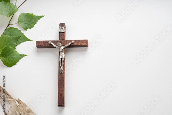 Fototapeta Christian Pentecost. Whit Sunday. A cross with a birch branch on a white, green, red and black background.