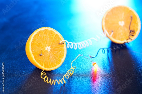 Fototapeta Free energy electricity generator using oranges.