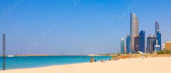 Obraz View of Abu Dhabi with sea, beach and skyscrapers. Travel in UAE
