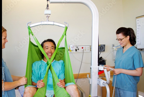 Obraz Getting patient out of bed with mechanical lift