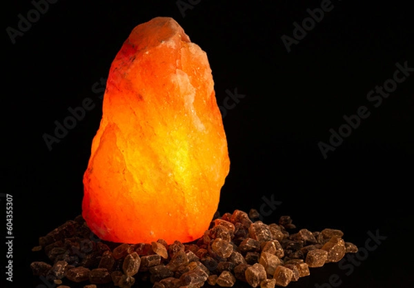 Obraz Crystal Emitting Light On A Dark Background