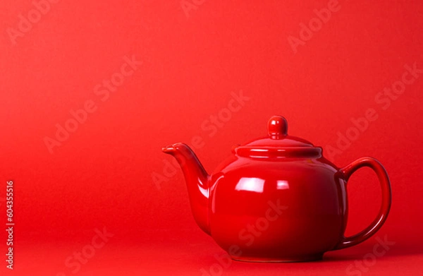 Obraz Red Teapot On A Red Background