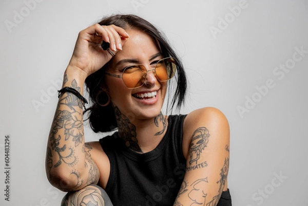 Fototapeta portrat of a Gen Z tattoo girl laughing
