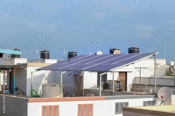 Fototapeta Solar panel system on the terrace in Indian City. Domestic use of Solar Electricity system System 