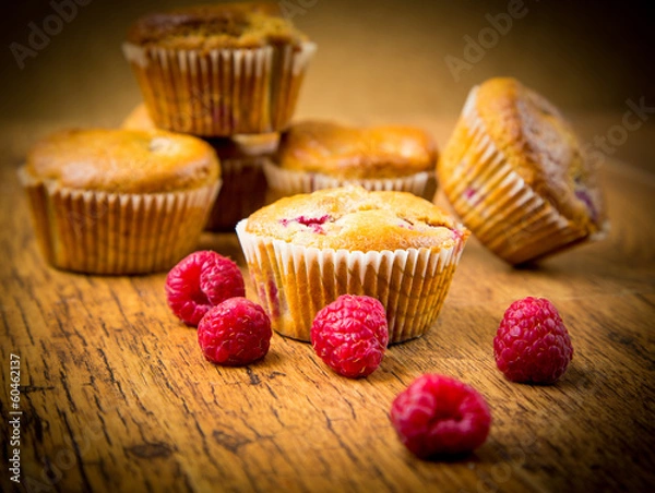 Fototapeta Raspberry muffins on wooden background