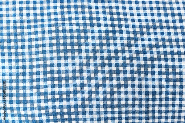 Fototapeta Fabric, tablecloth in blue check, can be used for background.
