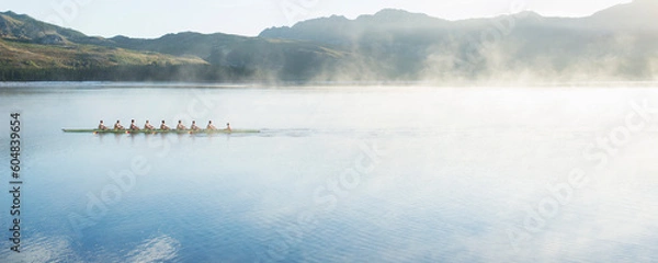 Obraz Rowing team rowing scull on lake