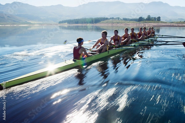 Fototapeta Rowing team rowing scull on lake