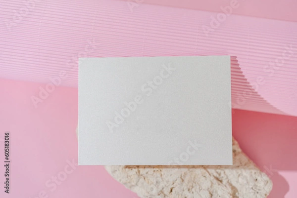 Fototapeta White glitter wedding invitation card mockup on pink background top view. Folded woman business card mock up. Name card, place card, birthday folded card mockup