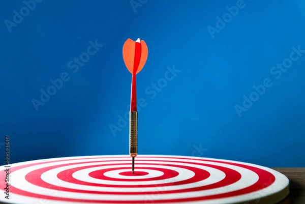 Fototapeta Dart hitting on center target