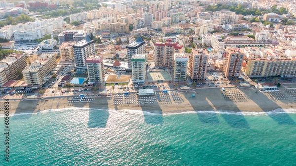 Fototapeta Fuengirola Spain, Aerial view on Coast of sea and buildings. Drone photo of coastal town