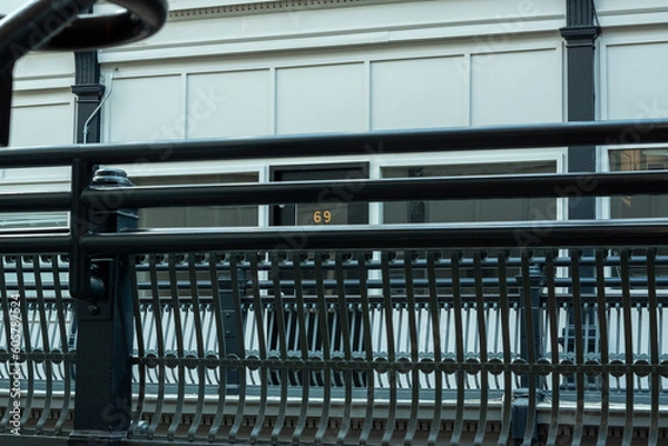 Fototapeta business through railing 