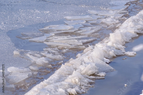 Fototapeta broken ice with ice ridges on the river in winter