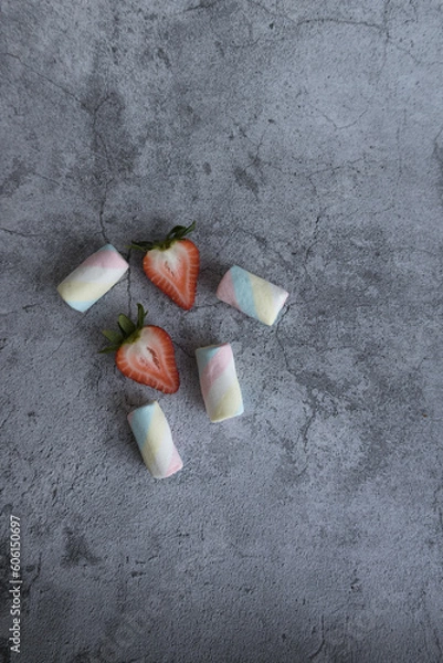 Fototapeta On a beautiful background of marshmallows and strawberries. View from above.