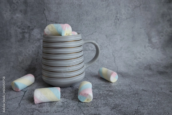 Fototapeta On a beautiful background, a mug with marshmallows. View from above.