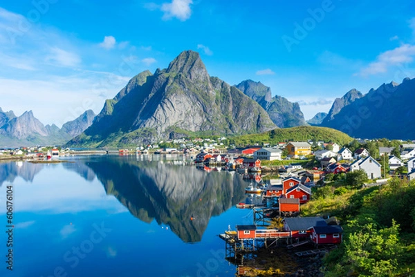 Fototapeta Perfect reflection of the Reine village on the water of the fjord in the Lofoten Islands,  Norway