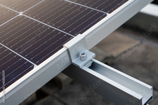 Fototapeta Close up on the clamp at the edge of the solar panel.