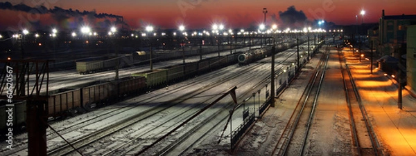 Fototapeta Panorama of railway station at sunrise in winter