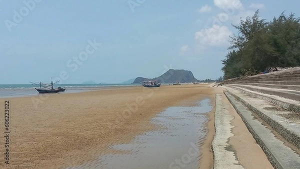 Obraz Mountain Coastal Escape: Scenic Beach with Fishing Boat