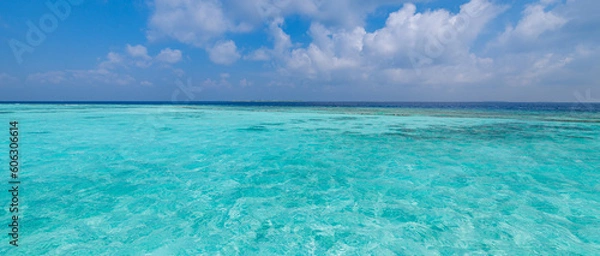 Fototapeta Mediterranean tropical sea blue seascape with relaxing white clouds horizon line and azure sky. Turquoise ocean lagoon bay. Panoramic Earth ecology environment concept. Crystal clear seaside