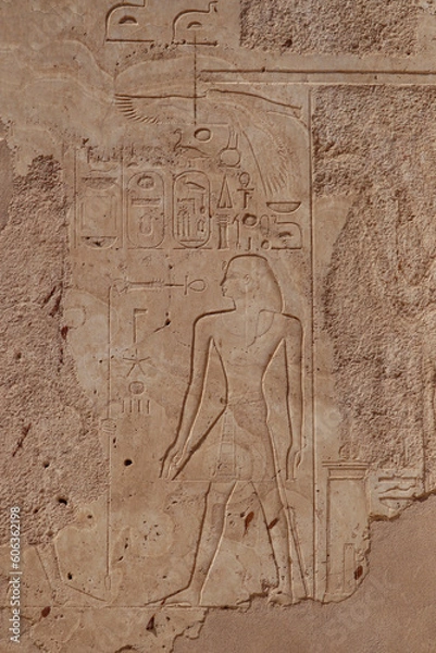 Fototapeta Ancient egyptian wall reliefs and pharaonic symbols carved at Karnak temple in Luxor, Egypt 