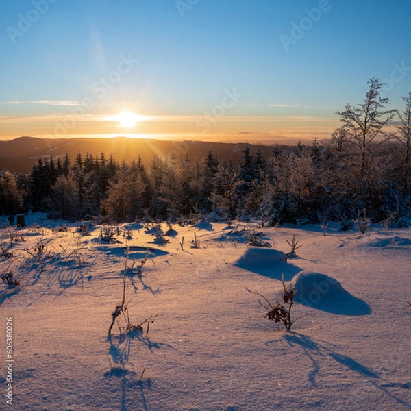 Obraz Footprints of the first climber to reach the summit during sunrise in Beskydy mountains, Czech republic. Breathtaking winter scenery with a view of passing clouds and sun. Hiking lifestyle.