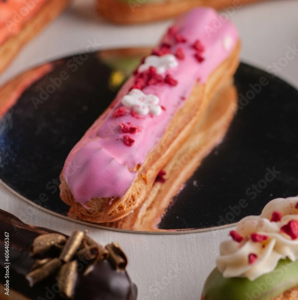 Obraz eclairs with different fillings and decorations in different options