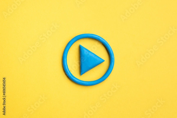 Fototapeta  3d simple play button, 3d media play sign on yellow background. Plasticine object.