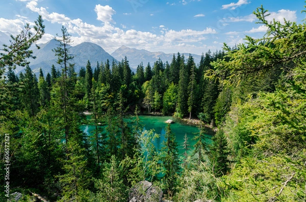 Obraz Beautiful blue and green lake with pines and mountains