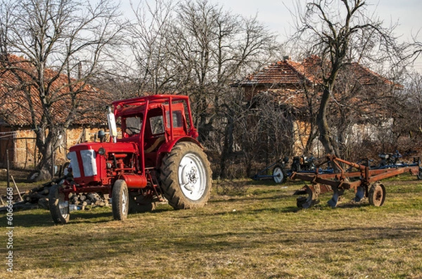 Fototapeta View from a mountain farm with tractor on meadow