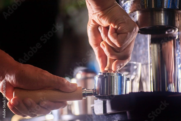 Fototapeta hands tamping porta filter for perfect espresso