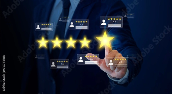 Obraz Businessman pointing five star symbol to increase company rating.