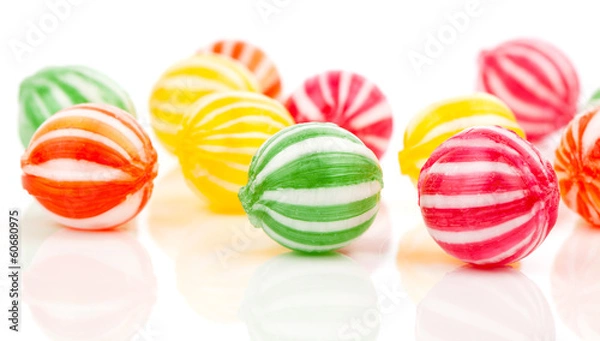 Obraz colored candies isolated on white.