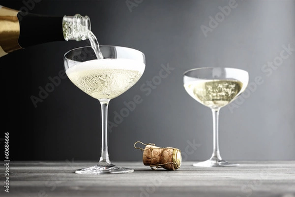 Obraz Champagne being filled in Coupe Glasses