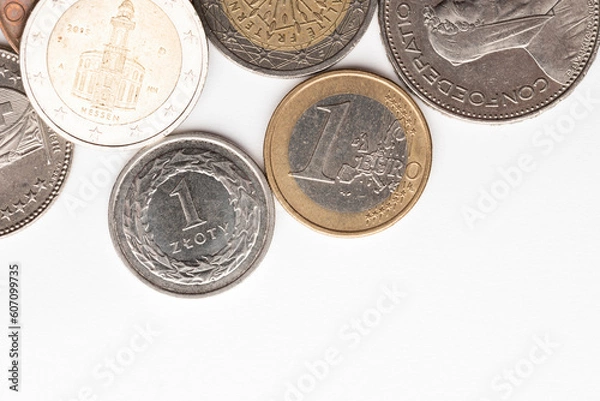 Obraz swiss francs currency, polish zloty currency and euro currency coins on white backgorund