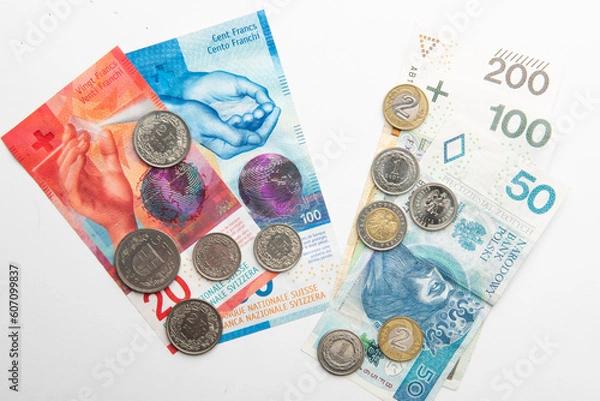 Obraz polish zloty currency and swiss francs currency coins and banknotes