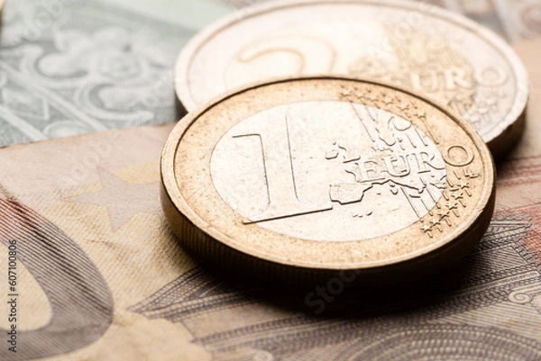 Obraz Euro currency coins on banknote close-up