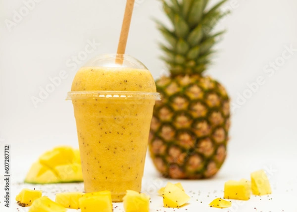 Obraz pineapple mango smoothie on a white background