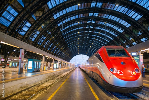 Fototapeta Railroad Station with a Train in Dusk in Milan, Lombardy in Italy.