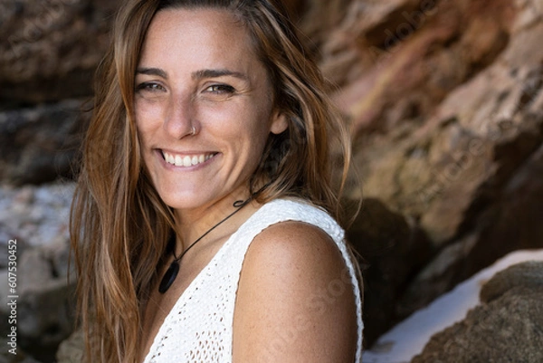Obraz Young Caucasian woman laughs happily on the beach