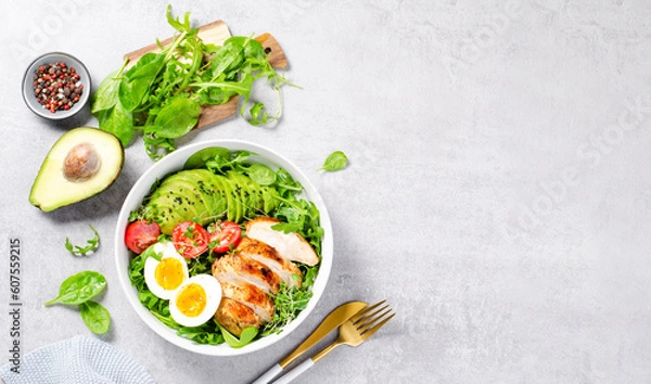 Fototapeta Grilled Chicken Fillet with Fresh Salad, Cherry Tomatoes, Boiled Egg and Avocado, Budha Bowl, Keto Paleo Diet Menu