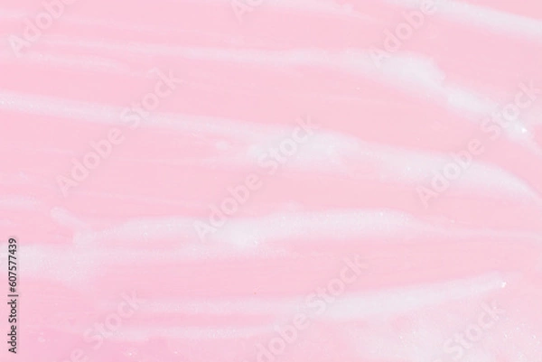 Fototapeta Smeared greasy melting cream. On a pink background.