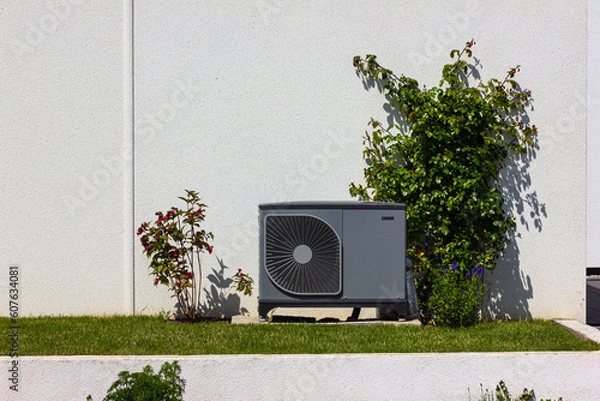 Obraz heat pump in a new building area with modern house facades