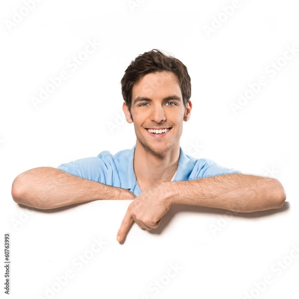 Obraz Junger Mann zeigt auf Textfreiraum