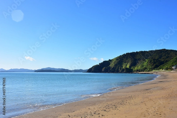 Fototapeta Calm sea with practically no surf wave at Long Beach in Russell. Location: Russell New Zealand