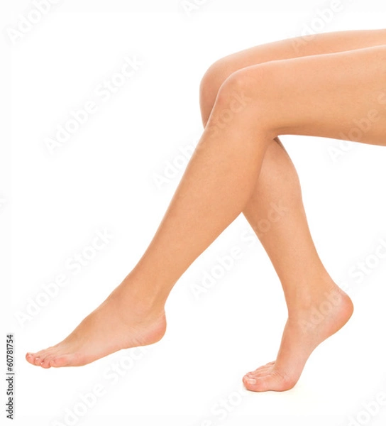 Fototapeta Woman's legs on white background