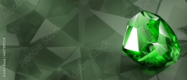 Fototapeta A big precious green crystal like an emerald with highlights and shadow on a color background. Faceted gemstone