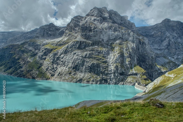 Fototapeta View of the Limmernsee dam in the canton of Glarus. Hiking high above the mountain lake in the Alps. Limmernsee Lake, Glarus, Switzerland