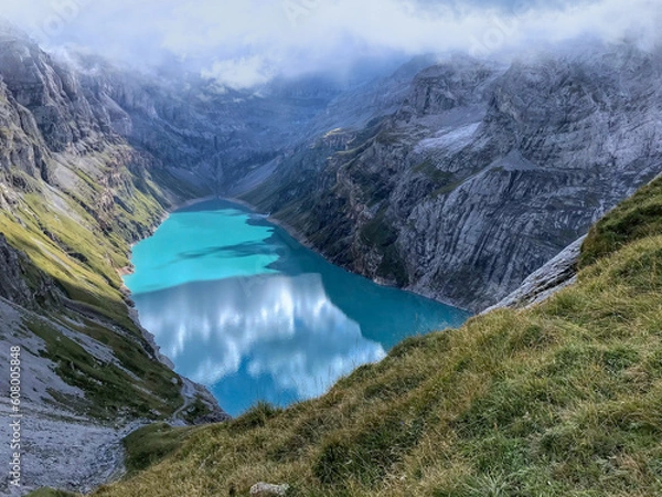 Fototapeta View of the Limmernsee dam in the canton of Glarus. Hiking high above the mountain lake in the Alps. Limmernsee Lake, Glarus, Switzerland