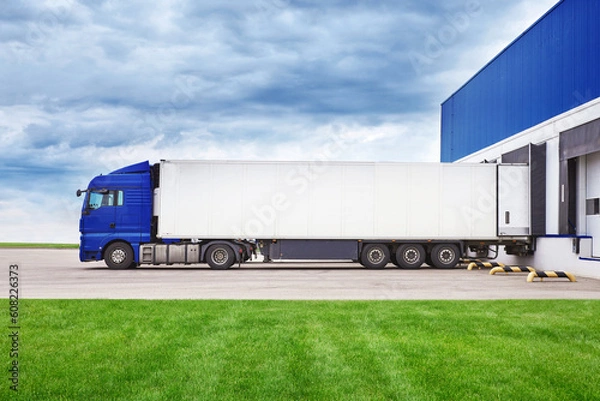 Fototapeta Truck loading process. The process of loading cargo into a truck from a warehouse